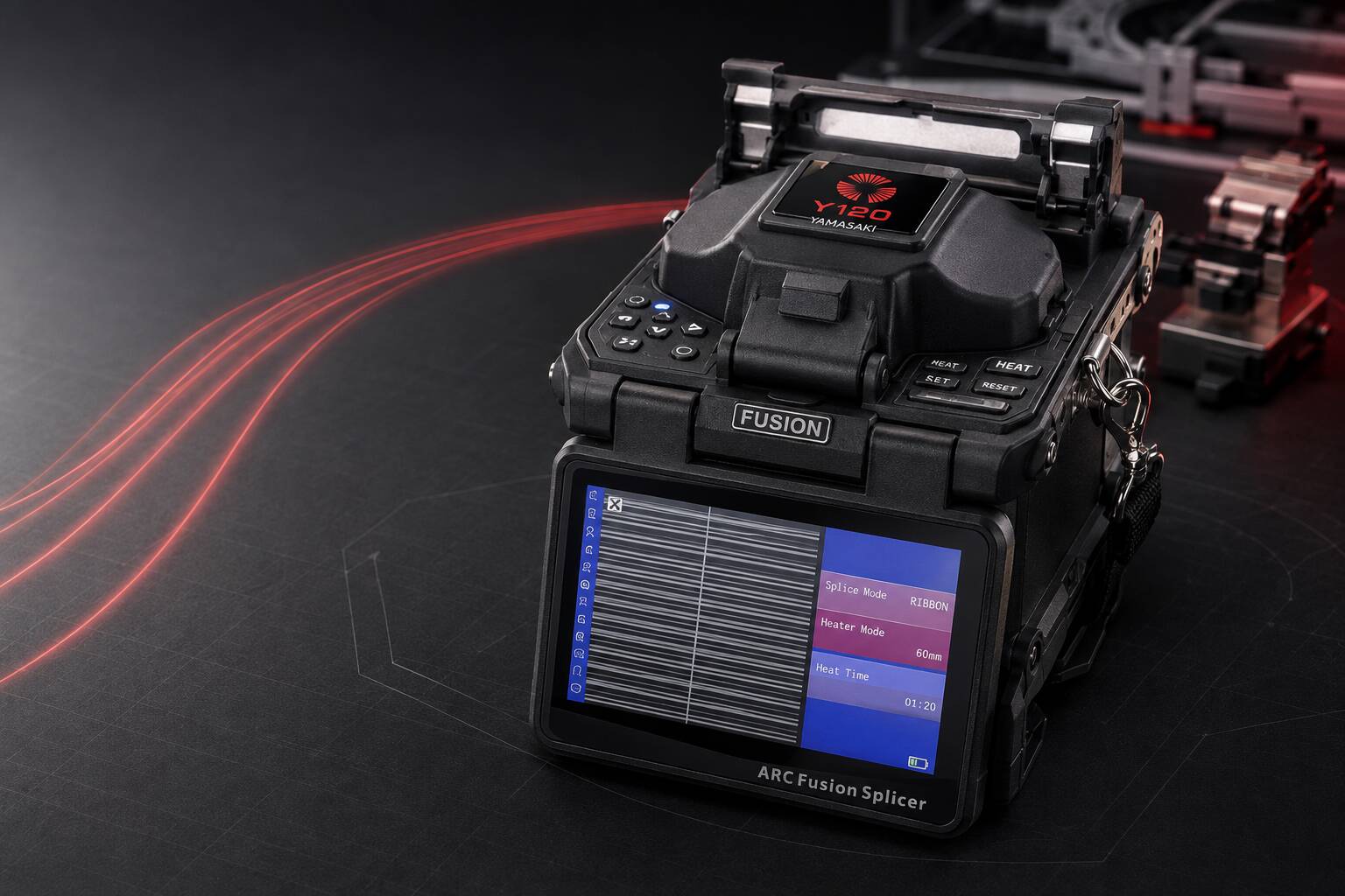 Yamasaki Y120 Ribbon Fusion Splicer with red ribbon fibre trails in a dark technical workspace